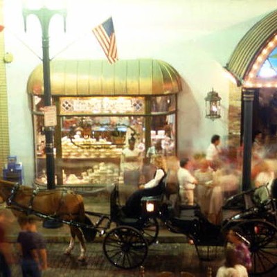 View showing a horse-drawn carriage in front of Rosie O'Grady's at Church Street Station, likely taken after 1972.