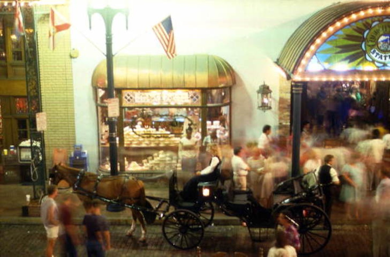 View showing a horse-drawn carriage in front of Rosie O'Grady's at Church Street Station, likely taken after 1972.