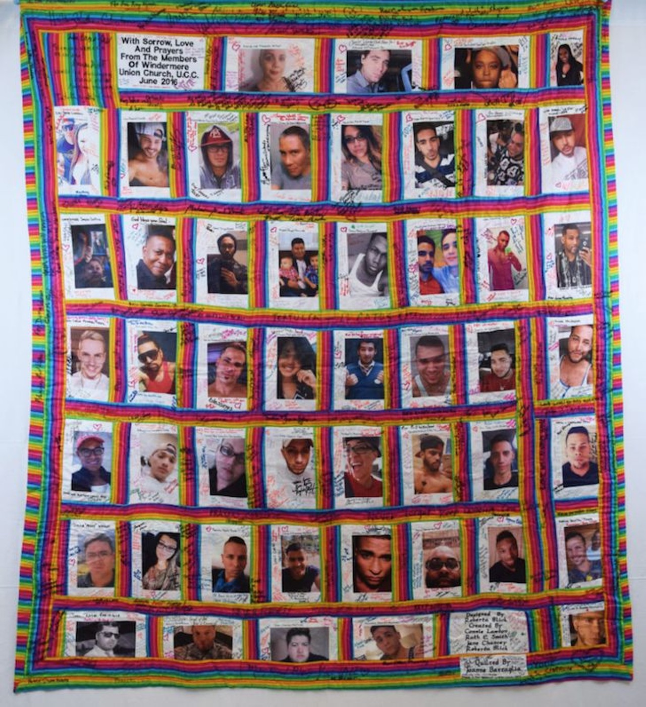 Quilt 
Description: 
Quilt with photos of the 49 victims of the Pulse Nightclub shooting on a rainbow border. The quilt is covered with handwritten messages and signatures.
Historical Notes:
Roberta Blick, a 90-year-old congregant from Windermere Union Church, created this quilt featuring the photos of those who died at Pulse. Nancy Rosado of Proyecto Somos Orlando, a new service organization supporting those affected, traveled with the quilt. She gathered signatures, including those of President Barack Obama, Jennifer Lopez, Lin-Manuel Miranda, and Hillary Clinton. This quilt was her last creation before she passed away on December 20, 2017.