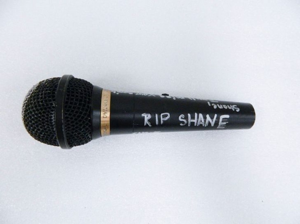 Microphone 
Description: 
Microphone with a handwritten message in silver marker that says, &#147;Shane, I WILL MISS YOU FOREVER. Shane, I will miss your smile, laughter & your beautiful soul! Love you Forever. RIP SHANE. I (heart) u !!!&#148; There is a white heart drawn on the windscreen of the microphone.