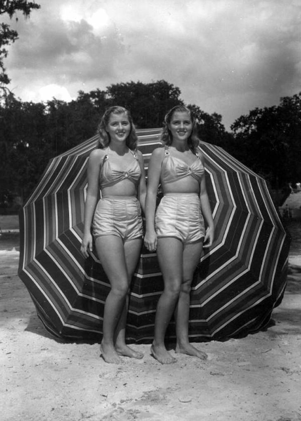 Unidentified women stand on the beach area of the springs - Sanlando Springs, 1946.