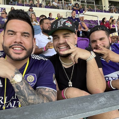 Padilla with his influencer client LeJuan James (center) at an Orlando City soccer game