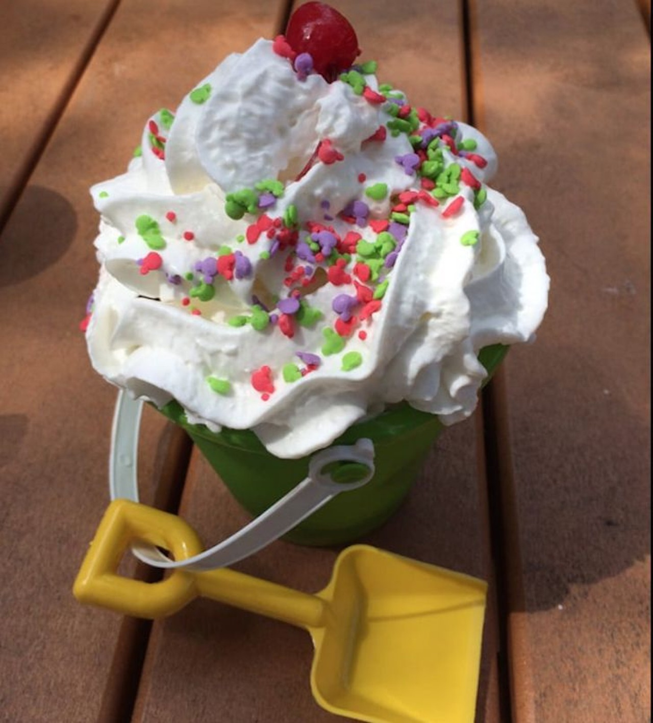 I.C. Expeditions at Blizzard Beach: Sand Pail Sundae  
1534 Blizzard Beach Drive
Cool off on a hot Florida day with a sand pail for dessert. This toy bucket is stuffed with vanilla and chocolate soft-serve ice cream, waffle pieces, cookie pieces, sprinkles, hot fudge and caramel and topped with whipped cream and a cherry.
Photo via Yelp/Tina W.