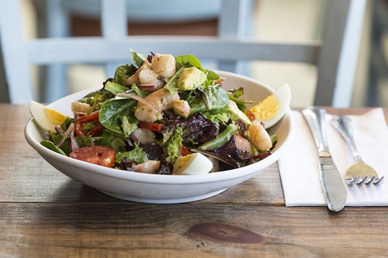 Be sure to try the Gulf Coast Salad; tomatoes, onions, green beans, bacon,
avocado, hard-boiled egg, red onion, romaine lettuce and Florida shrimp, coarsely chopped with a vinaigrette dressing.  
Photo via Rob Bartlett