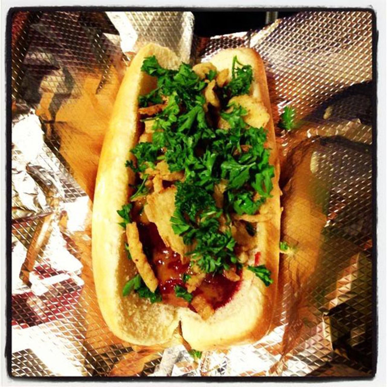Holiday dog at Vegan Hot Dog Cart
65 N. Orange Ave., 321-303-3689
The VHDC's Holiday Dog &#150; with fried sweet onions, homemade cranberry sauce, Carolina mustard barbecue sauce, and parsley &#150; was named "the top dog in the nation" by PETA last year, if you care about stuff like that. It's also fricking delicious.
Photo via Vegan Hot Dog Cart Facebook