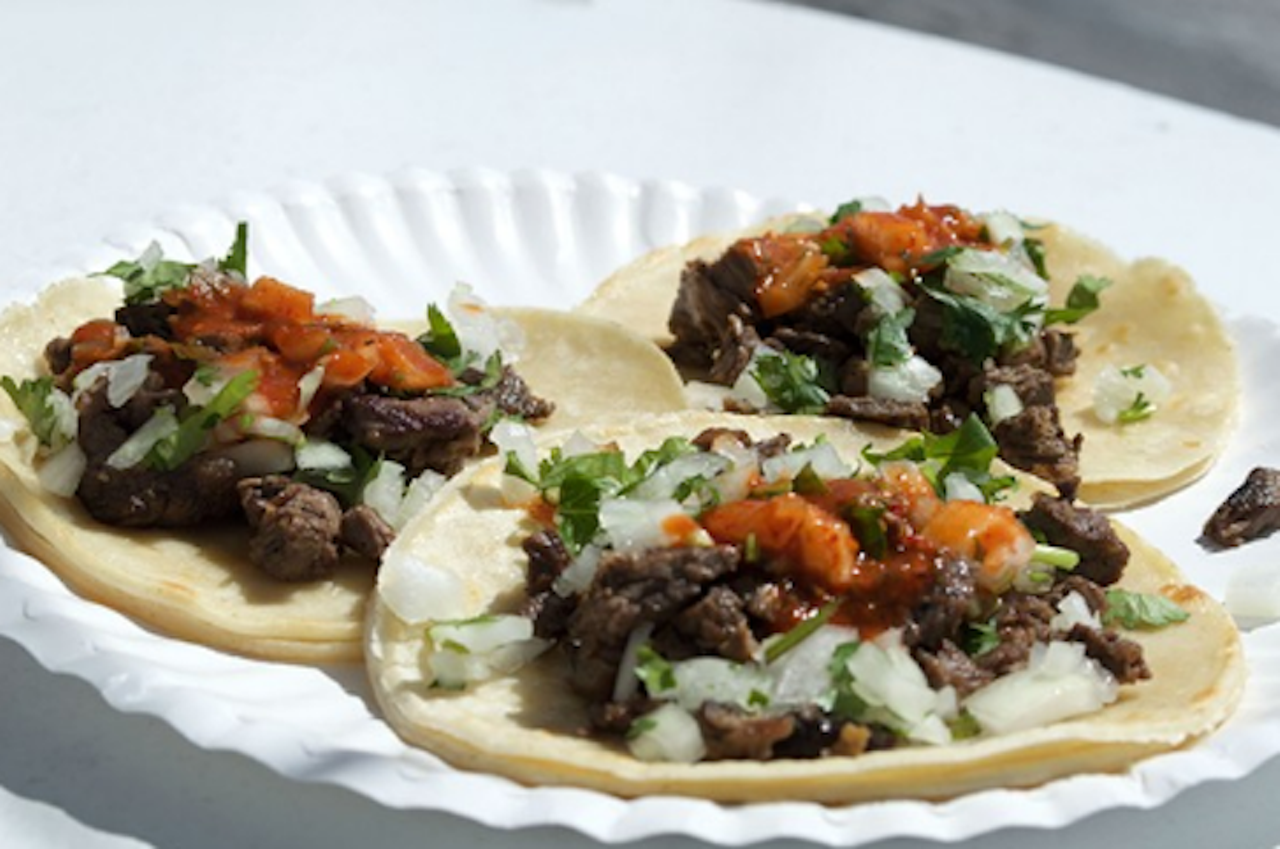 Best Street Tacos: Carne asada tacos at Tortas El Rey
6151 S. Orange Blossom Trail, 407-850-6980
There are three basic requirements to look for in a street taco before you sit down: double corn tortillas, salsa roja strong enough to give you a small asthma attack and lengua on the menu. Tortas El Rey has all of these things, qualifying them for consideration. And their carne asada tacos are some of the best in town. For less than $3, you can buy one pocket of meat heaven at this remodeled Checkers drive-thru and have enough cash left to buy a medium horchata to wash it down.
Photo by Monivette Corediro