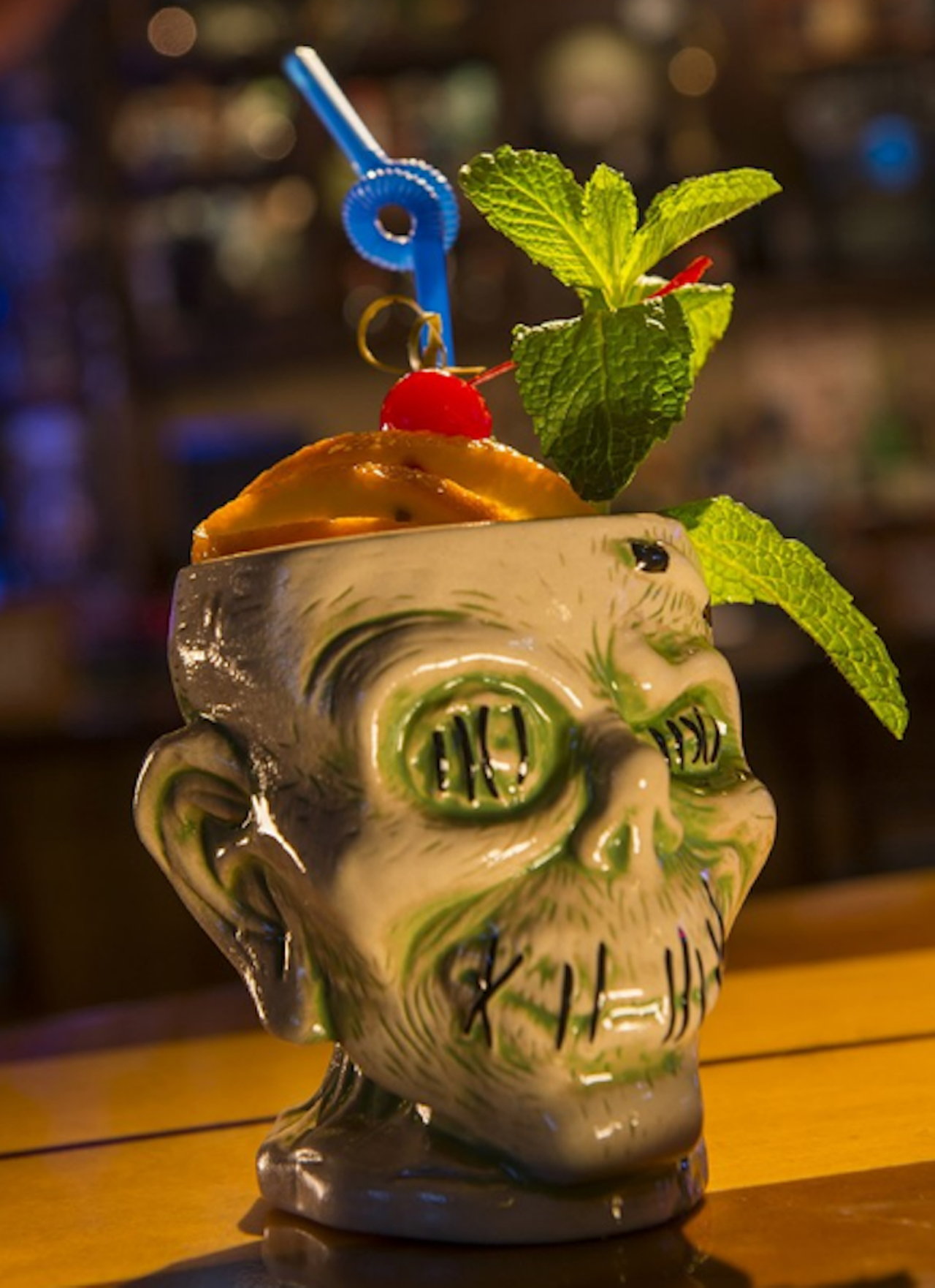 Best Tiki Drink: Shrunken Zombie Head at Trader Sam&#146;s Grog Grotto
Disney's Polynesian Village Resort, 1600 Seven Seas Drive, 407-824-2000,
Disney World
It's sticky and sweet and fruity and just screams "I'm on vacation, bitches!" (the dangerous combo of three different aged rums, fruit juice and falernum means you better be), but the best part about this not-cheap cocktail, an homage to the tiki craze of the 1960s, is that you get to keep the vessel the concoction comes in &#150; a ceramic shrunken head replica.
Photo courtesy of WDW