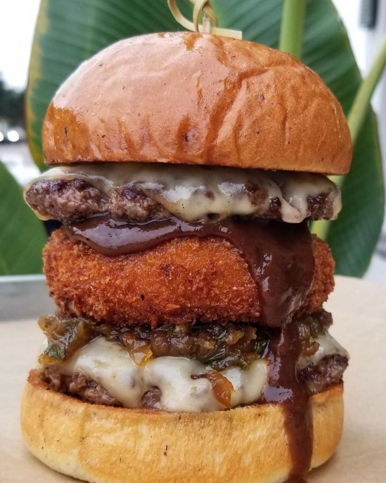 Swine & Sons 
Multiple Locations
Check out their truffle mac and smash attack. It includes two beef patties, melted swiss, fried truffle mac and cheese, smoked bone marrow caramelized onions and a house steak sauce on a truffle brioche bun.
Photo via Swine & Sons/Facebook