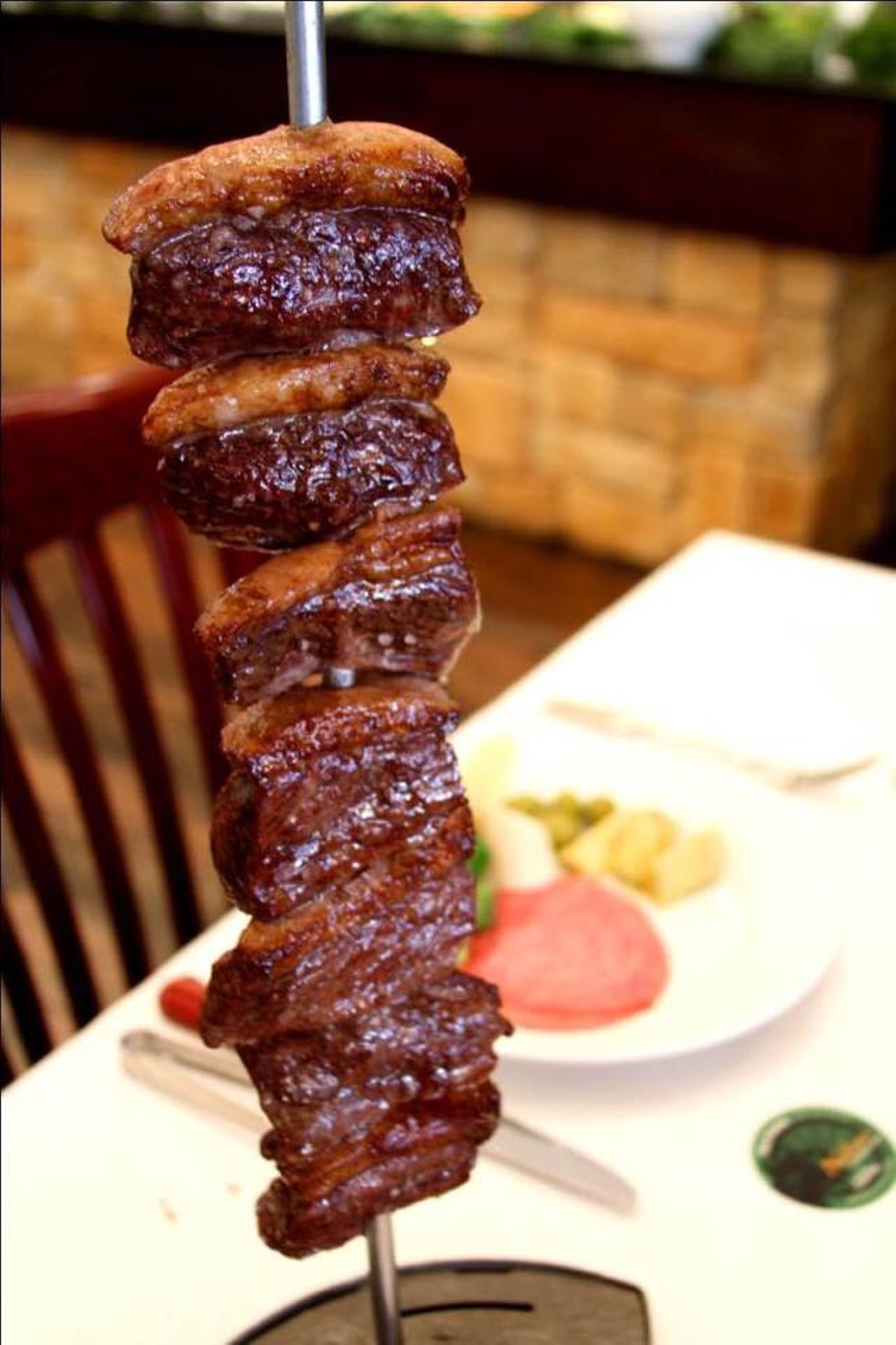 Nelore Churrascaria
Park Avenue churrascaria offers?up an awesome 40-item salad bar, comprising crisp vegetables, fish, soup and more, but it&#146;s the all-you-can-eat-meat extravaganza that packs &#146;em in. Our advice: Stick to the sirloin cuts (top sirloin and picanha) and avoid the lamb. Scrumptious Brazilian desserts are made in-house. 115 E. Lyman Ave., Winter Park, 407-645-1112; $$$$Restaurant review: Nelore ChurrascariaPhoto via Nelore Churrascaria Winter Park on Facebook