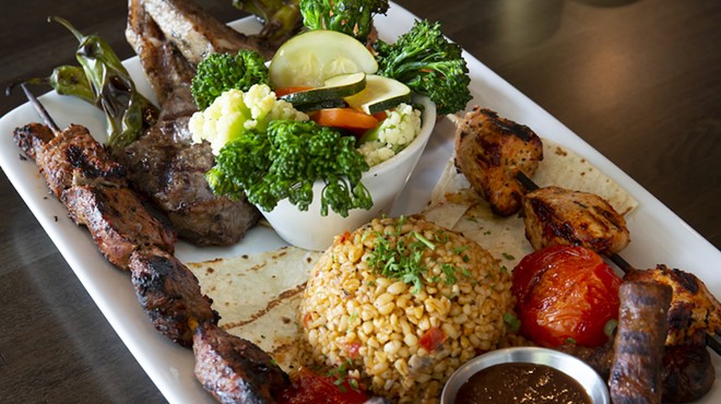 The Bridge Special Selection: Two gorgeous lamb chops, mini beef sausages, and brochettes of seasoned filet mignon and chicken served over lavash, with bulgur and seasonal vegetables