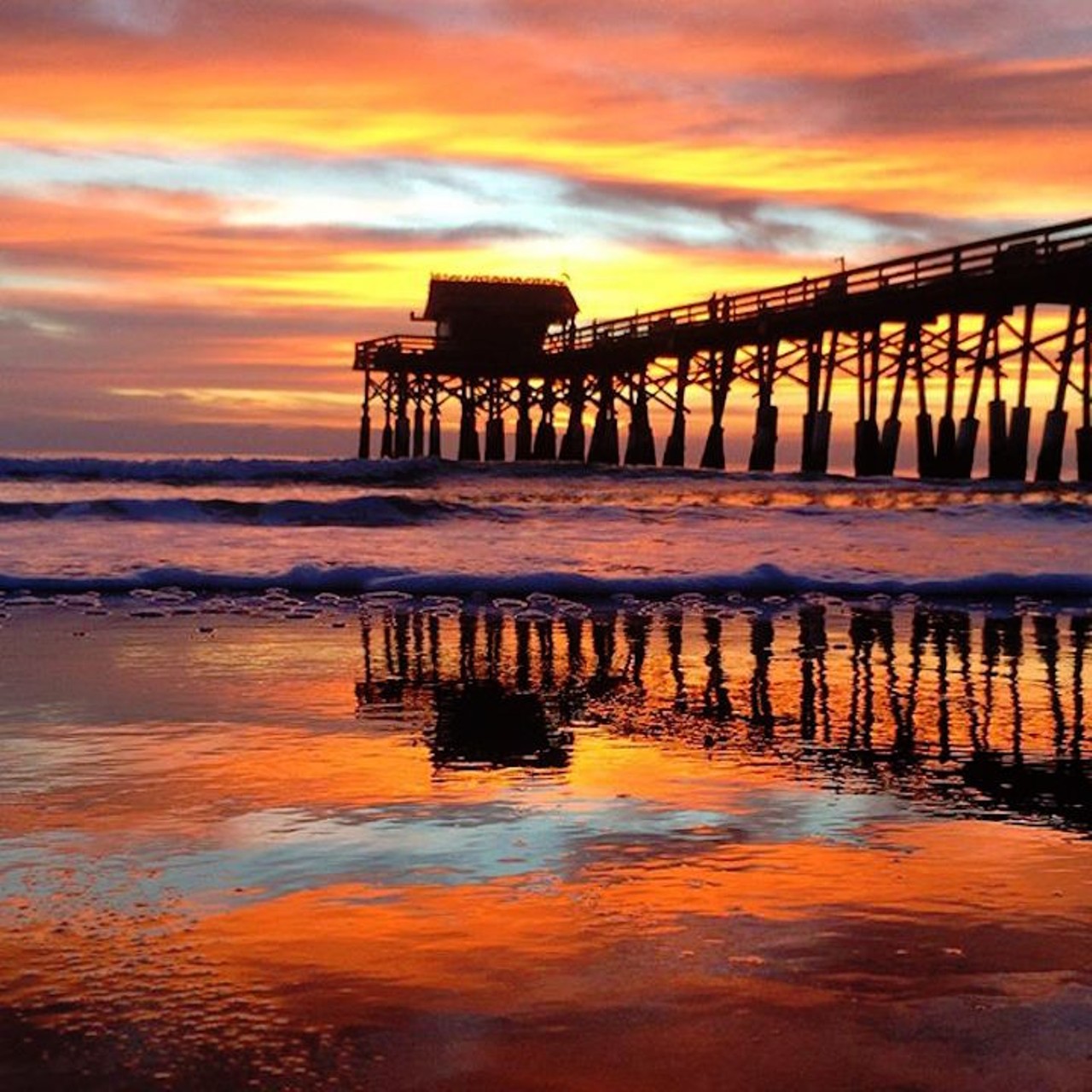 12. The Cocoa Beach pier
By this point in the day, you'll both probably be covered in sand, but those colors sure make it worth it.
Photo via sonsoftheseatv/Instagram
