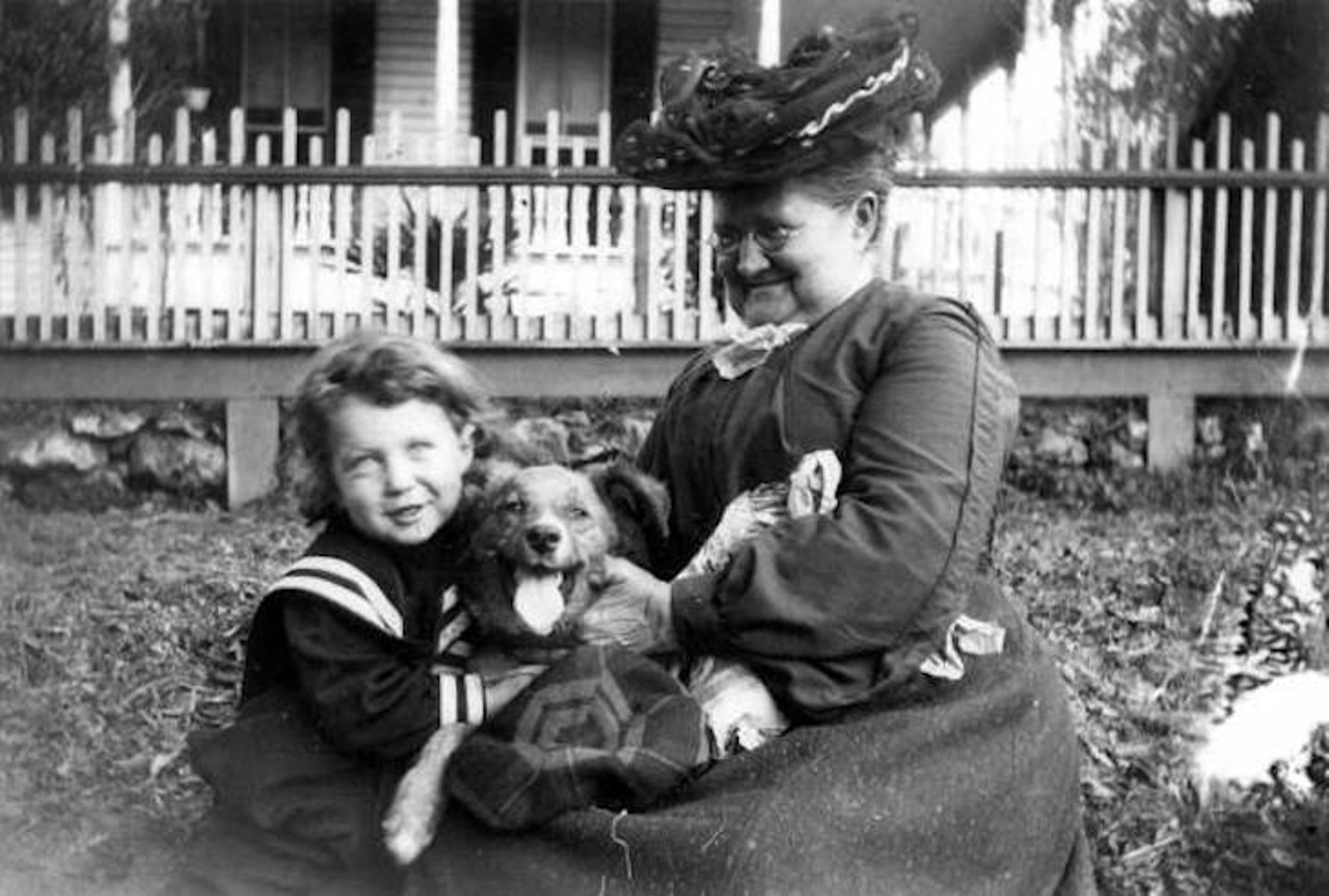 A boy, dog and woman enjoying each other's company in Tallahassee, Florida, taken sometime in the 1910s.