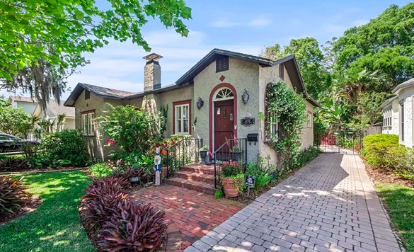 This 1920s Arts &amp; Crafts College Park home comes with an ivy-covered guesthouse