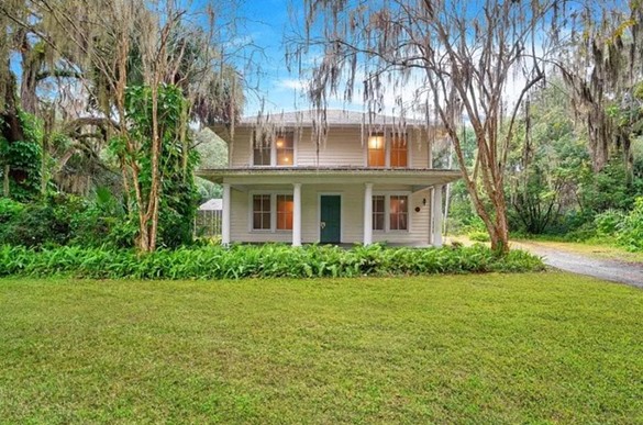 This historic Sanford farmhouse comes with a swimming pool and a guest house for $400K