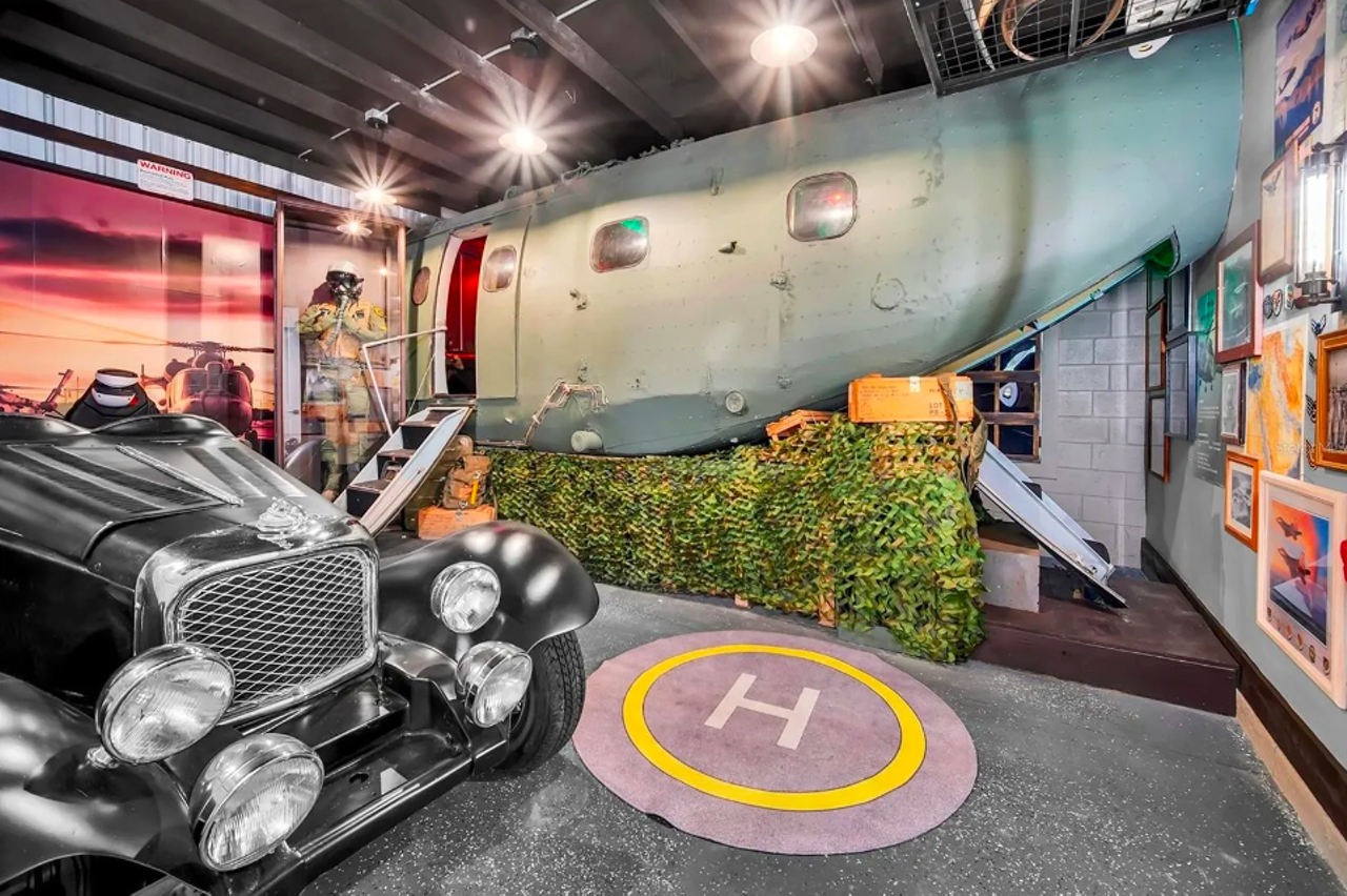 This Orlando-area home comes with a real retired military helicopter inside of it