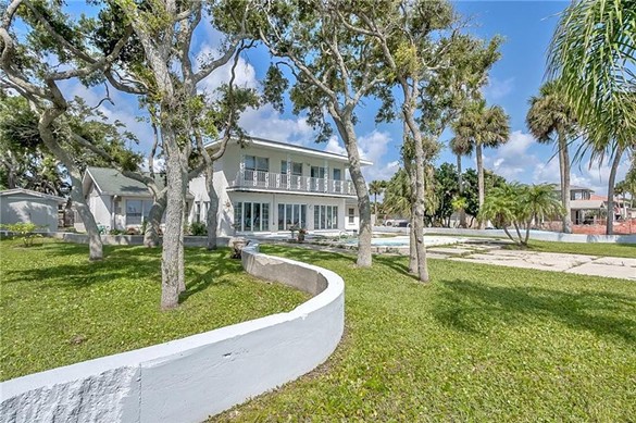 This South Daytona waterfront home for sale has its own tennis court