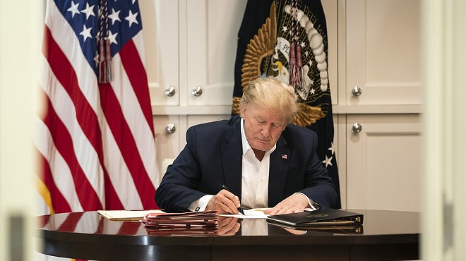 President Trump hard at work signing blank pieces of paper. They say this home-schooling thing is hardest on the parents, who have to keep the kids occupied