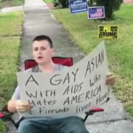 Trump supporter and local asshole holds homophobic sign outside of Orlando man's home