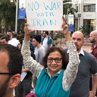 All the best signs from Orlando's 'No War with Iran' protest