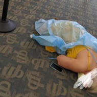 Photo showing woman lying on floor of Florida COVID-19 antibody clinic goes viral