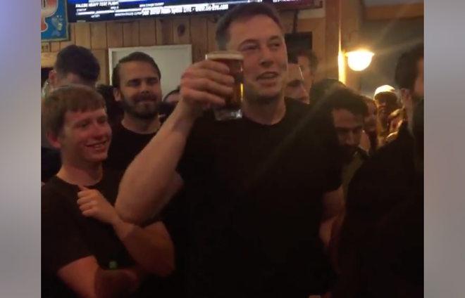 Here's Elon Musk drinking a beer at a bar in Port Canaveral after the SpaceX Falcon Heavy launch