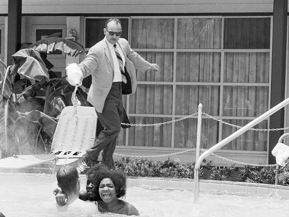The owner of the Monson Motor Lodge in St. Augustine attempting to enforce his "whites only" pool rules in 1964.