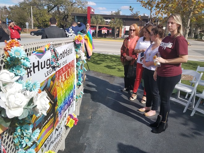Natasha McImurray and her co-workers stand in front of the Pulse Interim Memorial. - Elizabeth Gondar