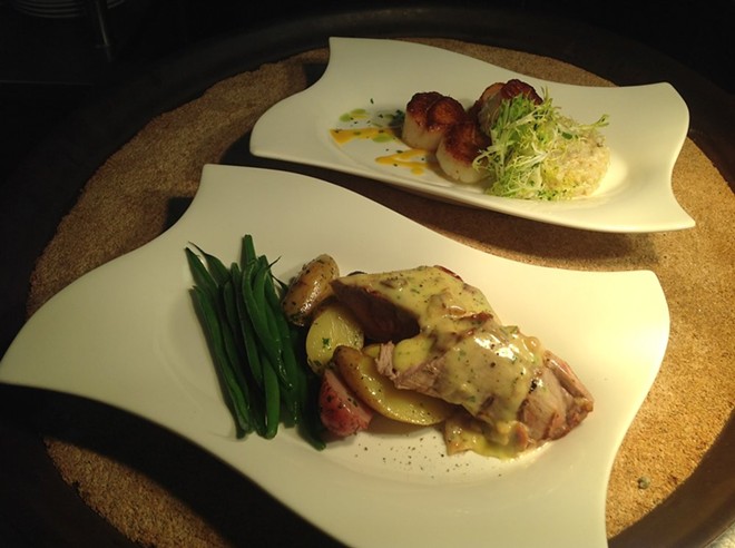 Chef Nathaniel Russell's seared diver scallops with leek pearl couscous and roasted pork tenderloin with bacon hollandaise - IMAGE VIA CAFE DE FRANCE ON YELP
