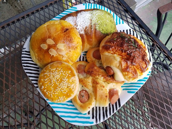 Clockwise from top: Matcha bun, cheese and hot dog bun, garlic and hot dog bun, Sweetheart cookie, pineapple taro bun - HOLLY V. KAPHERR