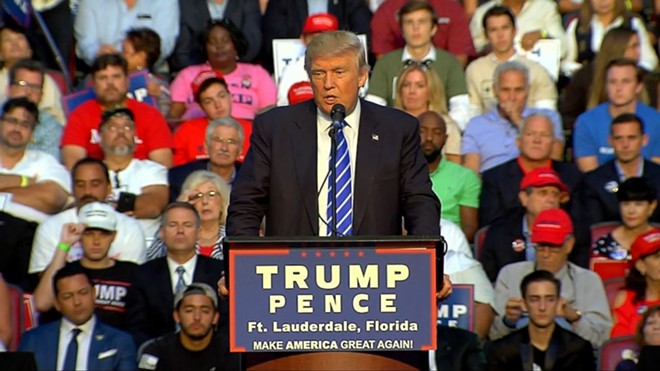 Disgraced ex-congressman Mark Foley sits behind Trump at Florida rally