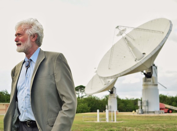NASA's chief scientist and chief technologist, Barry Geldzahler, introduces a high-power radar system that can detect asteroids and comets 100,000 times more accurately than telescopes. - photo by Joey Roulette