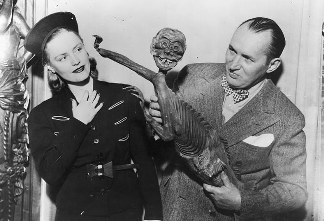 Robert Ripley with the "Fiji Mermaid", which turned out to be a hoax consisting of a monkey torso attached to a fish. - Photo via Ripley's Believe It or Not