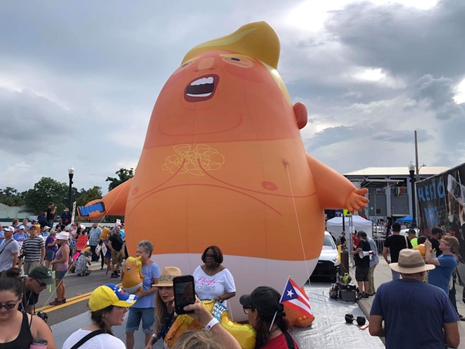Baby Gasbag isn't going anywhere today; he's full of hot air but pinned to the ground. - PHOTO BY BARBARA SHERIDAN FOR ORLANDO WEEKLY, JUNE 18, 2019