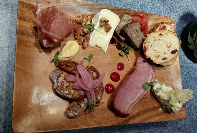 Charcuterie palette, artisan cured meats, Nueske’s applewood-smoked duck breast, cheese