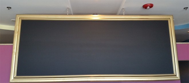 The gilded chalkboard will announce new flavor offerings