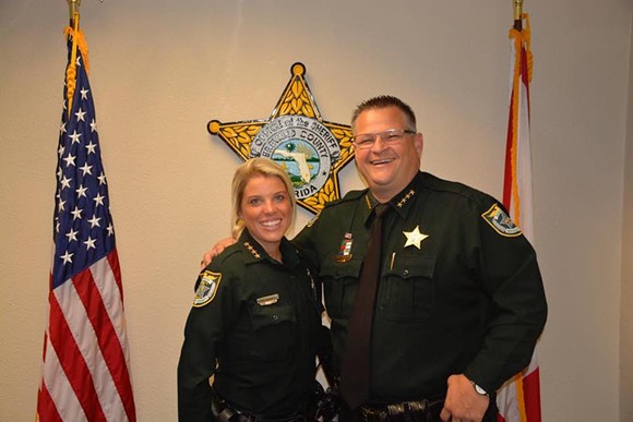 If you don't fit in with the Evangelical motto "In God We Trust," or pretend like you do, well, you can go fuck off. Brevard County Sheriff Wayne Ivey is the bro on the right. - Photo via Brevard County Sheriff's Office Facebook