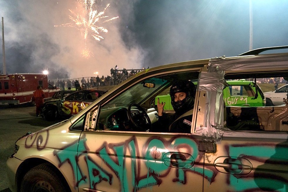 Taylor Bosak is ready for her upcoming minivan demo derby as the fireworks show ends. (Orlando Speedway, Nov. 29, 2019) - Photo by Christopher Balogh