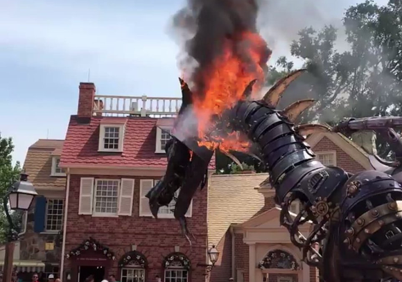 A dragon catches on fire at Walt Disney World in 2018 - Screenshot via Darkaxian/Youtube