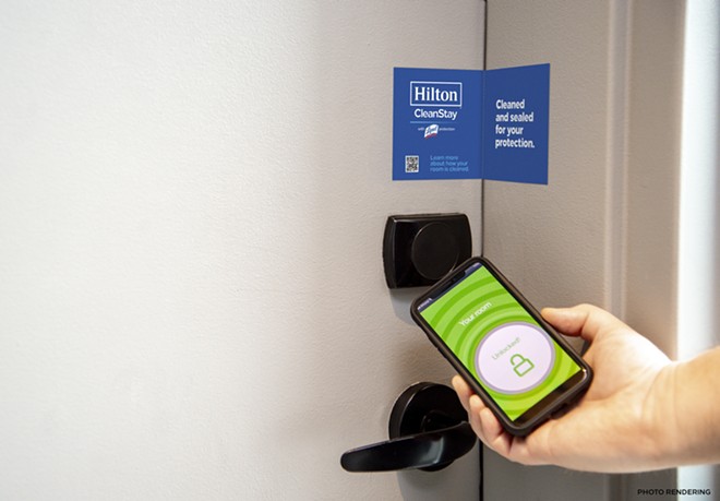 Hilton's CleanStay with Lysol includes placing a seal on the door of each suite after the room is cleaned. Also, guests can use their phones to check-in and access room keys, ensuring safe social distancing and fewer shared surfaces. - Image via Hilton