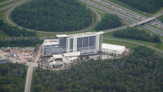 An aerial image from late 2019 showing the then still under construction JW Marriott Bonnet Creek Creek Resort & Spa with traffic on nearby I-4 seen in the upper corner of the image. - Image via Bioreconstruct | Twitter