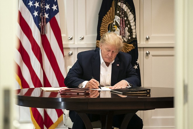 President Trump hard at work signing blank pieces of paper. They say this home-schooling thing is hardest on the parents, who have to keep the kids occupied - Official White House Photo by Joyce N. Boghosian