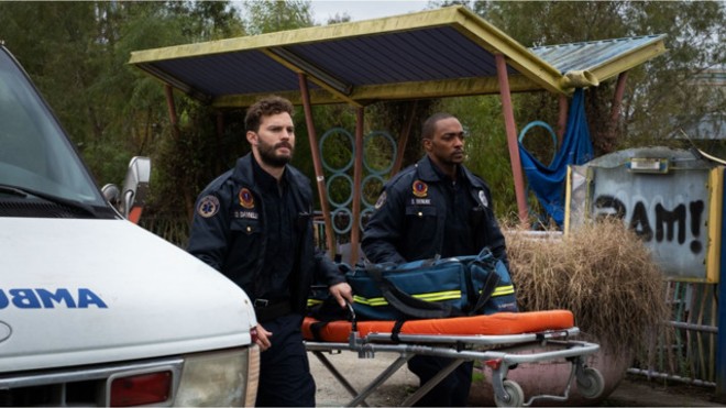 Paramedics Dennis, left, and Steve take care of New Orleans' wounded, and each other, but they aren't prepared for where "Synchronic" will take them. - WELL GO USA ENTERTAINMENT