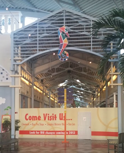 Signage inside the Festival Bay mall teasing the upcoming plans that were never realized. Instead, the mall became Artegon and is now home to Dezerland. - Image via Ken Storey