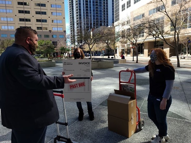 Activists deliver thousands of 'past-due' invoices to Sen. Marco Rubio's Orlando office staffers - Sierra Williams