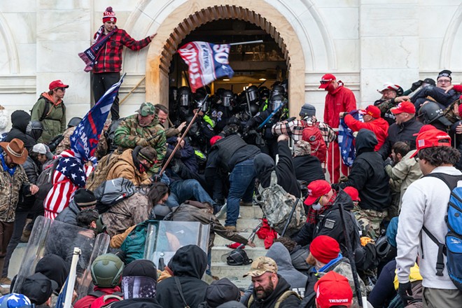 Rioters clash with police trying to enter Capitol building through the front doors (Jan. 6, 2021) - PHOTO BY LEV RADIN