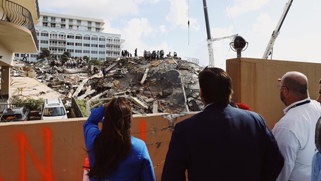 Florida Gov. Ron DeSantis looks at the rubble of the Champlain Towers collapse. - PHOTO VIA TWITTER/RON DESANTIS