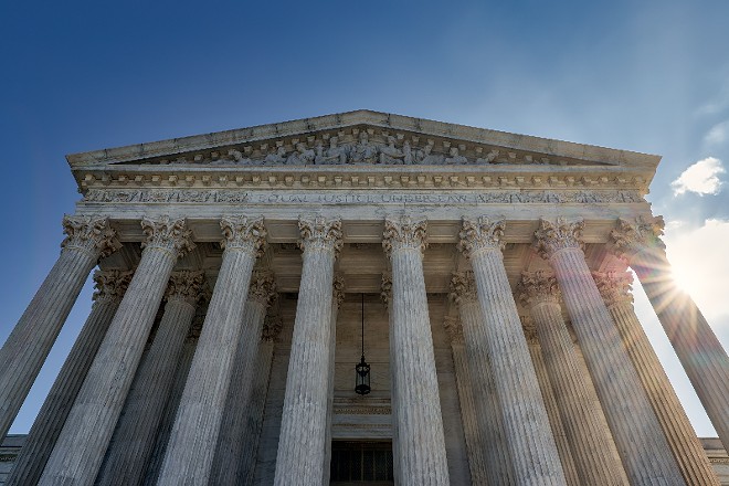 The Supreme Court ruled in favor of a healthcare vaccine mandate while striking down a federal mandate on large employers. - ADOBE