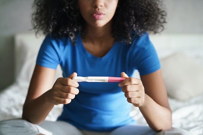 "While we waited for the results on a dollar-store pregnancy test, which took about an hour ... I was told all the ways that an abortion would be a terrible mistake." - Adobe Stock
