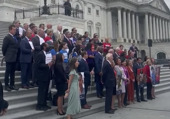 House Democrats singing on the steps. - YouTube screengrab