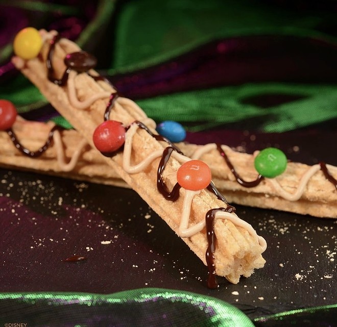 Churro dusted with peanut and chocolate sauce and peanut butter M&M's. - Via @DisneyParks on Instagram